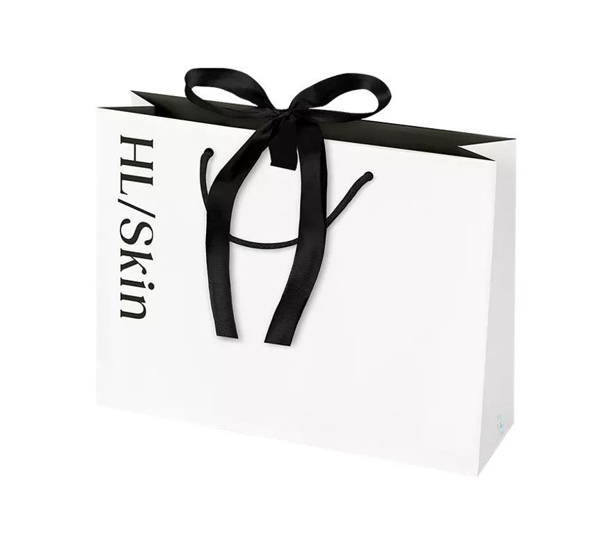 Bolsa de regalo pequeña HL/Skin blanca con lazo negro, ideal para presentar productos de cuidado de la piel
