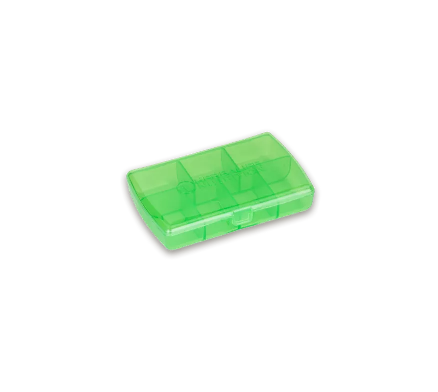 Pastillero pequeño individual de viaje de color verde translúcido Herbalife Nutrition.